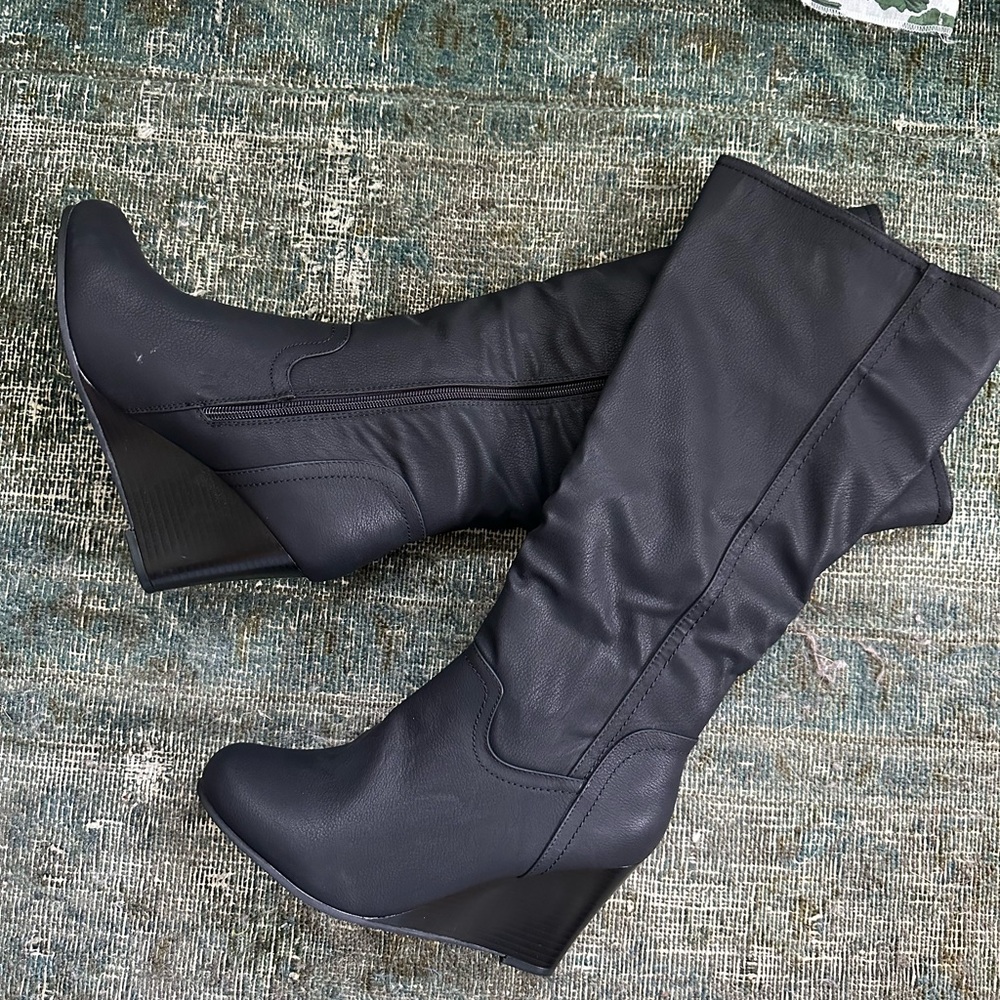 Tall black wedge boots